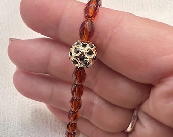 Brown Crystal Faceted Barrel Bead Bracelet w/ Black Spinel Fireball Brass Accent Bead