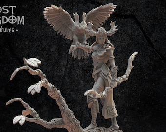 May include: A miniature figurine of a female elf with antlers, holding a bird of prey and a bow, standing on a tree stump with leaves. The figurine is made of gray plastic and is part of a fantasy miniature collection.