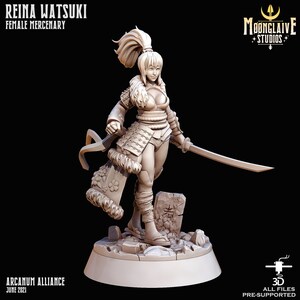 May include: A 3D-printed figurine of Reina Watsuki, a female mercenary, holding a katana. The figure is in a dynamic pose, wearing armour with fur trim and a high ponytail. The base includes the text "Arcanum Alliance June 2021" and the Moonclaive Studios logo.