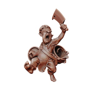 May include: A brown, sculpted figurine of a goblin chef wearing a chef's hat and apron, holding a cleaver in one hand and a pot in the other. The goblin has a wide, open mouth and a fierce expression.