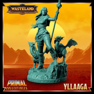 May include: A green painted miniature figurine of a female warrior with a staff and two small winged creatures. The figurine is set on a circular base with the words "PRIMAL COLLECTIBLES" and "YLLAAAGA" printed on the base.