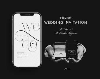 May include: A smartphone displaying a white wedding invitation with the text 'WE DO' and 'OLIVIA & THOM' next to two open black ring boxes containing wedding bands. The text 'PREMIUM WEDDING INVITATION' and 'Say 'We do' with Timeless Elegance' is visible.
