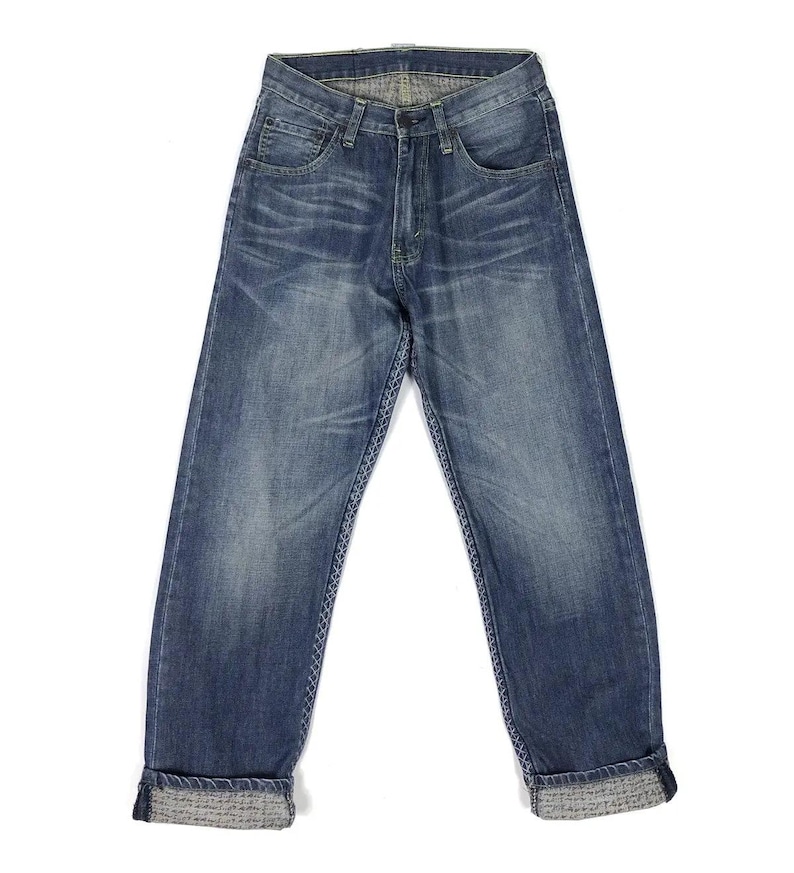 May include: A pair of blue denim jeans with a cuffed hem. The jeans have a classic straight leg fit and a faded wash.