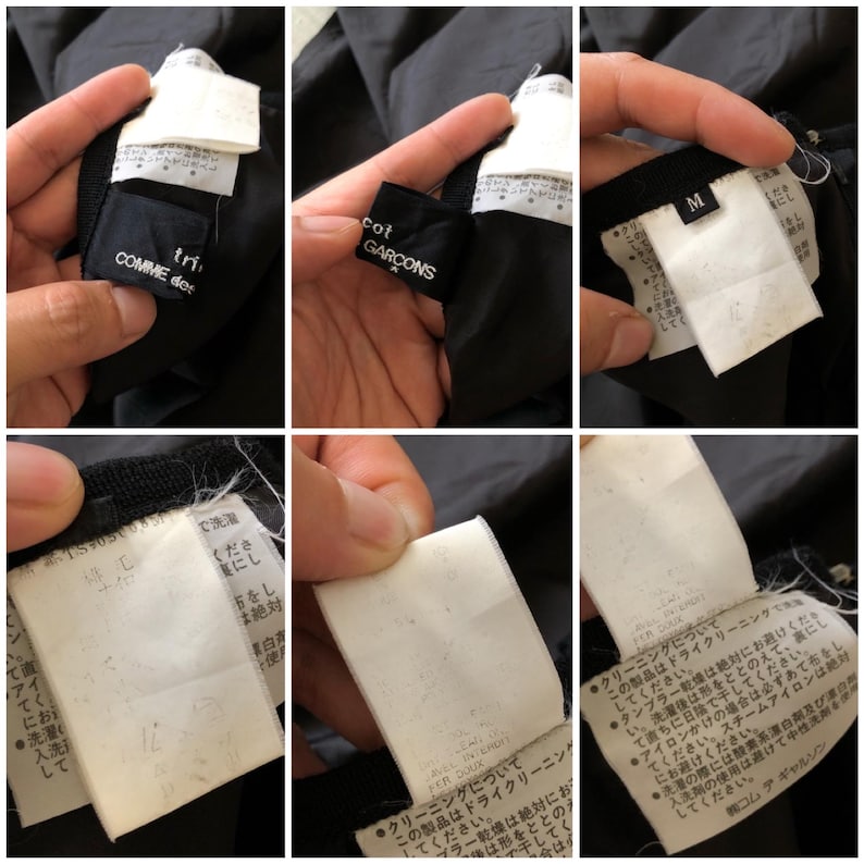 May include: Black Comme des Gar&ccedil;ons jacket with a white label that reads "Comme des Gar&ccedil;ons" and "Tricot" in Japanese. The label also includes care instructions in Japanese. The jacket has a size tag that reads "M".