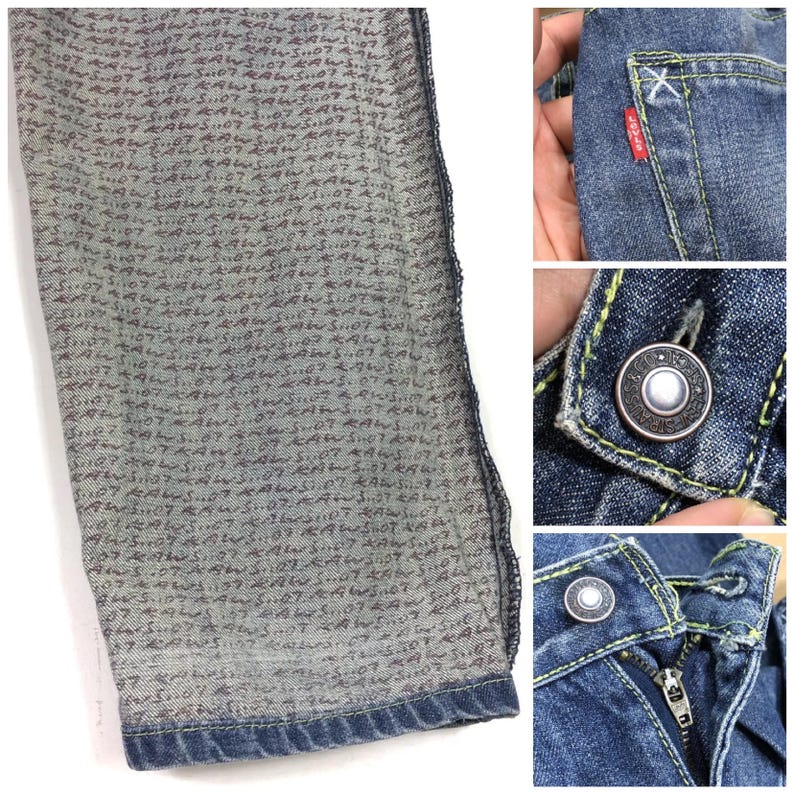May include: Close-up of the inside of blue denim jeans. The fabric has a unique pattern of small, dark red writing. The jeans have a yellow stitch detail and a silver button.