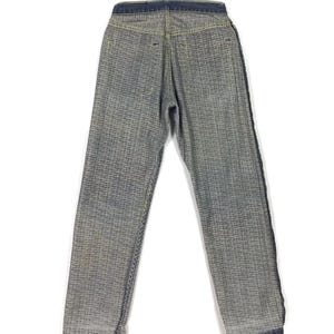 May include: A pair of blue denim jeans with a checkered pattern. The jeans have a dark blue waistband and a straight leg.