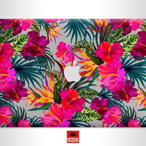 May include: A laptop skin with a tropical floral design featuring pink hibiscus flowers, green leaves, and yellow accents.