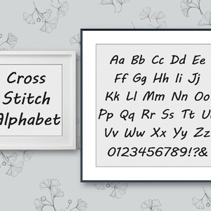 May include: A white frame with the text "Cross Stitch Alphabet" and a black frame with the alphabet in a cross stitch font, numbers, and punctuation marks.