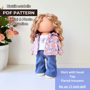May include: PDF pattern for a doll outfit, including a shirt with a hood, a top, and flared trousers. The outfit is designed for an 11 inch doll. The doll is wearing a white top with a koala print, a pink and white floral print shirt with a hood, and blue denim flared trousers.