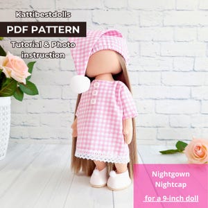 May include: A doll wearing a pink and white gingham nightgown and nightcap, with a white pom-pom on the cap. The doll is wearing white shoes. The image includes text that reads "PDF PATTERN" and "Nightgown Nightcap for a 9-inch doll."