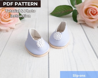 May include: A pair of light blue doll slip-ons with a white pearl embellishment on the toe. The shoes are 1.7 inches long and have a white interior. The image also includes text that says "PDF PATTERN" and "Tutorial & Photo instruction".