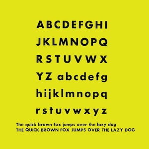 May include: A black and white alphabet font with uppercase and lowercase letters. The text "The quick brown fox jumps over the lazy dog" is displayed in the same font below the alphabet.