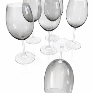 May include: Set of six clear wine glasses with a gray tint. The glasses have a classic design with a rounded bowl and a long stem. One glass is upside down. Perfect for serving wine at a dinner party or special occasion.