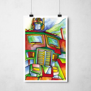 May include: A vibrant watercolour illustration of Optimus Prime, the Transformers character. The artwork uses bold lines and bright colours, including red, green, yellow, blue, and orange. The poster is hanging on a white wall.