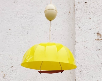 May include: A yellow plastic dome-shaped pendant light fixture with a white ceiling mount.