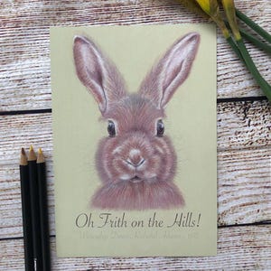 Stampa artistica di Watership Down con disegno di coniglio sorridente e citazione