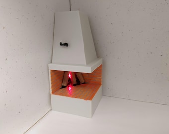 May include: A white miniature fireplace with a red light simulating a fire inside. The fireplace has a brick-like orange interior and a white chimney.