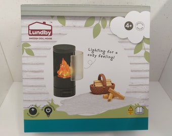 Lundby fireplace with lights, rug and wood basket. Brand new.