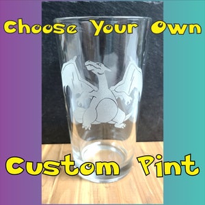 May include: A clear glass pint glass with an etched design of a white dragon with wings. The text "Choose Your Own Custom Pint" is visible in the image.
