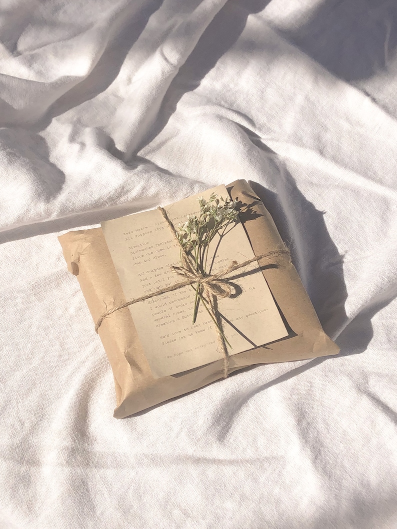 May include: A brown paper package tied with twine and decorated with a sprig of white flowers. The package includes a handwritten note that reads "Earth Waste - All purpose inch - Directions: Taking 1/4 teaspoon, twice daily in water and allow to dissolve. All-purpose for the whole family. If you receive any of the above mentioned, a couple of hours and multiple times, then cleaning a bath is several times.  We'd love to hear back if you have any questions. Please let us know if we can help you with anything else.  Be happy you enjoy using our products!"