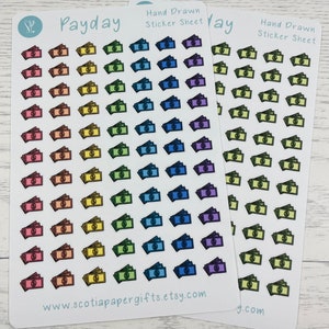 May include: Two sticker sheets with the word "Payday" printed on them. Each sheet has 36 hand-drawn stickers of stacks of money in various rainbow colours. The text "Hand Drawn Sticker Sheet" is printed on each sheet. The website address "www.scotiapapergifts.etsy.com" is printed on one sheet.