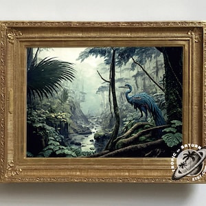May include: A framed painting of a blue bird with a long neck and tail standing in a lush green jungle with a stream running through it. The painting is in a gold frame with a decorative border.