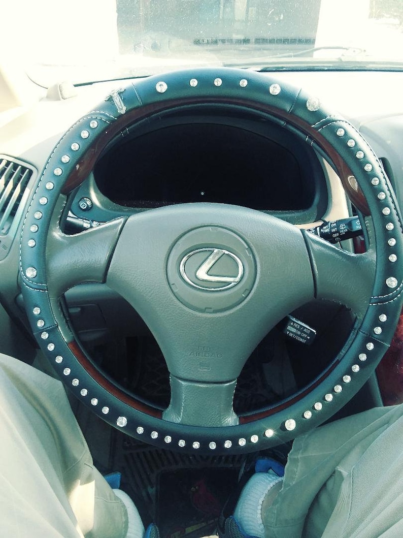 B  Black leather with stitching  TravelRosary steering wheel image 1
