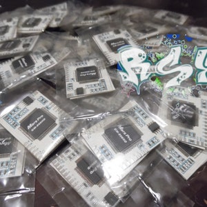 May include: Multiple clear plastic bags containing small white circuit boards with the text "Mars Pro GM-B06HD" printed on them.