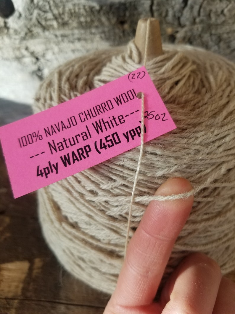 May include: A skein of natural white Navajo Churro wool yarn. The label reads "100% Navajo Churro Wool --- Natural White --- 250z 4ply WARP (450 ypp".