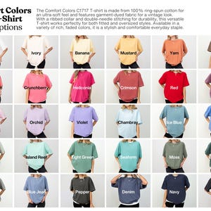 May include: A display of Comfort Colors C1717 T-shirts in various colors, including white, ivory, and black. The image showcases the color options available, with each shirt labeled with its respective name. The text describes the shirts as made from ring-spun cotton.