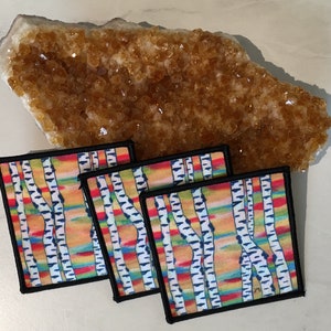 May include: Four colorful square patches with a black border, each featuring a watercolor-style image of a birch tree forest with white bark and a rainbow-colored background.