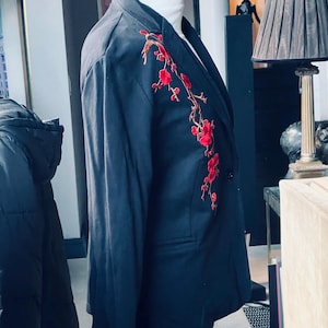 Black lightweight cotton shirt style black Jacket with a red oriental blossom branch  and a red and gold dragon no label fits UK 10 to 12
