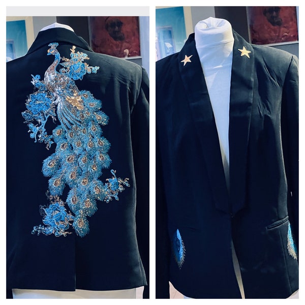 Black tuxedo cut blazer with a turquoise and gold peacock and matching feathers and gold stars size 18
