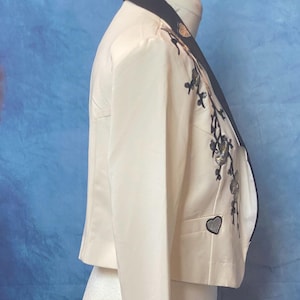 Black and Cream Cropped Jacket. Embellished with  Silver Oriental  Blossom and Silver Hearts. UK Size 10