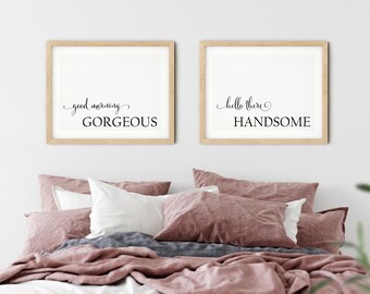 May include: Two framed prints with white backgrounds and black text. The left print says "good morning gorgeous" and the right print says "hello there handsome".