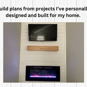 May include: A white shiplap wall with a black flat screen TV mounted above a wooden shelf. Below the shelf is a black electric fireplace with a realistic flame effect.