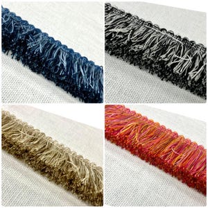May include: Four different colors of fringe trim, including navy blue, black and white, beige, and orange and red.
