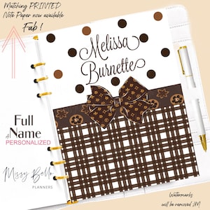 May include: A personalized planner insert with a brown bow and a brown and white checkered pattern. The insert features the name "Melissa Burnette" in elegant script and the text "Full Name Personalized". A white pen is visible.