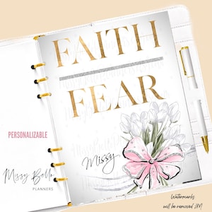 May include: White planner with gold accents, featuring the words "FAITH" and "FEAR" in gold lettering. A bouquet of white tulips with a pink bow and the name "Missy" are also displayed. The planner is labeled "PERSONALIZABLE".