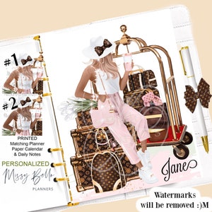 May include: A white planner with a gold ring binder. The cover features a digital illustration of a woman in a white top and pink pants sitting on a stack of luggage with a gold luggage cart. The text "#1", "#2", "PRINTED Matching Planner Paper Calendar & Daily Notes", "PERSONALIZED Missy Bello PLANNERS", "Jane", and "Watermarks will be removed :)M" is visible on the cover.