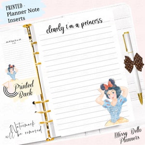 May include: A white planner page with a lined background. The page has a gold binder ring on the left side. The page has a cartoon image of Snow White with a red bow on her head. The text "clearly i'm a princess" is written at the top of the page. The text "Missy Bello Planners" is written at the bottom of the page.