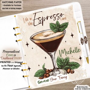 May include: A personalized planner dashboard insert featuring a martini glass filled with espresso, garnished with mint leaves and coffee beans. The text reads Life in the Espresso Lane, Michelle, and Shake Your Fancy. A white pen rests on the side.