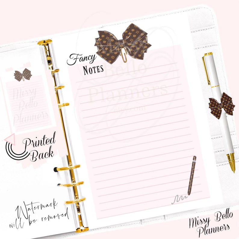 May include: A white planner with gold rings and a brown and white patterned bow on the front. The planner has a lined page with the words "Fancy Notes" written at the top. A pen with a brown and white patterned bow is on the right side of the page. The words "Missy Bello Planners" are written at the bottom of the page.