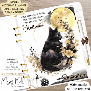 May include: A white planner with a black cat illustration, a full moon, and gold floral accents. The text "When black cats prowl and pumpkins gleam, may luck be yours on Halloween." is printed on the cover. The planner is personalized with the name "Samantha".