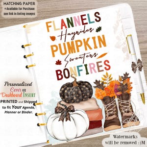 May include: A planner dashboard insert featuring the text FLANNELS, Hayrides, PUMPKIN, Sweaters, BONFIRES. The design includes a stack of pumpkins, one with a brown patterned print, and a pair of brown lace-up boots filled with autumn leaves.