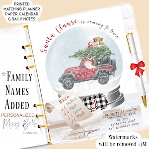 May include: A white planner with gold rings, a red and white snow globe with a red jeep carrying a Christmas tree and Santa Claus, and a white pen with a red bow. The planner has the text "Santa Clause is coming to town" and "Watermarks will be removed :)M".