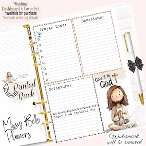 May include: A white planner with gold accents, featuring lined sections for prayer, devotions, and scripture. Includes a pen with a black bow and the text "Give it to God." The planner is from Missy Bello Planners.