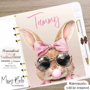 May include: Personalized planner cover or dashboard insert featuring a cute cartoon bunny wearing pink sunglasses and a pink bow. The bunny is blowing a bubble and the text "Tammy" is written in pink at the top of the image.