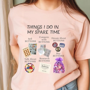 May include: A pink t-shirt with the text "Things I do in my spare time" and images of buttons. The text includes the phrases "Sell Buttons", "Compete with Buttons", "Dream About Buttons", "Talk About Buttons", "Research Buttons", and "Buy Buttons".