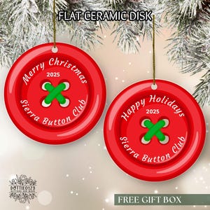 May include: Red ceramic disk ornaments shaped like buttons, with green stitching detail. One says "Merry Christmas 2025" and the other says "Happy Holidays 2025". Both have "Sierra Button Club" text. The top text says "FLAT CERAMIC DISK".